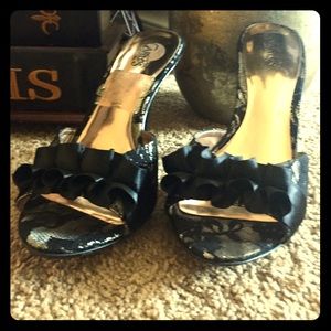 Black lace open toe heel, to big never worn.